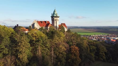 Famous Smolenice castle surrounded by Carpathian forest in autumn colors