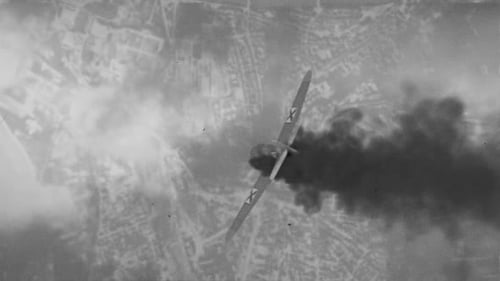 Airplane Flying with Smoke in Black and White