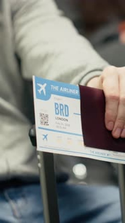 Vertical Video Waiting for Plane Arrival Boarding Pass and Man in Airport