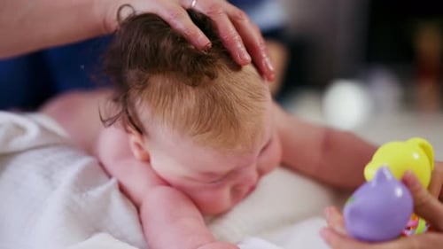 Calm Infant Lying Down Getting Gentle Head Massage