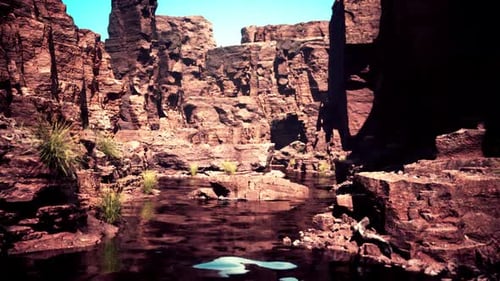 Beautiful Red River and Shores of Colored Sandstone