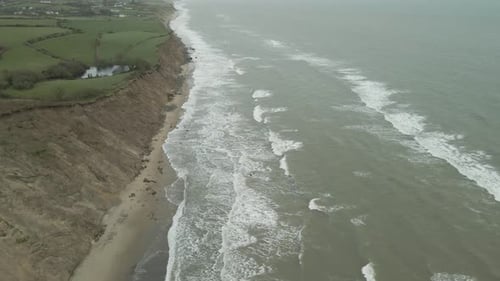 Rough Waves On The Coastline Of Ireland Near Wexford City On A Stormy Weather. - aerial shot