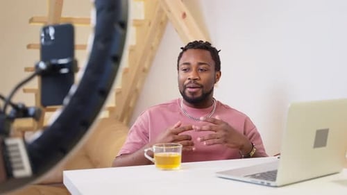African American Man Blogger Hipster Recording Video on Smartphone