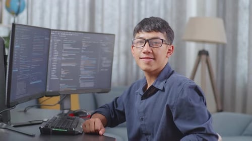 Asian Boy Programmer Smiling To Camera While Creating Software Engineer Developing App, Program