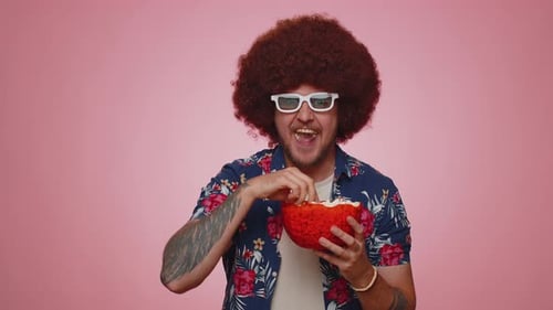 Excited Man Eats Popcorn With 3D Glasses