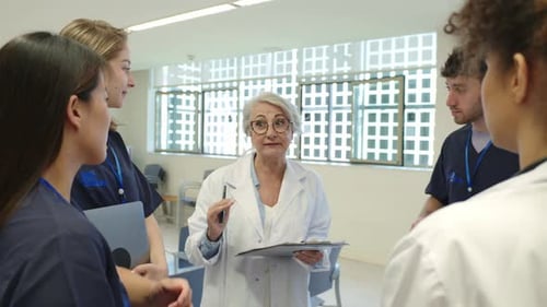Medical Team Discussing Patient Care in Hospital