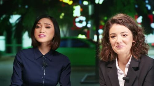 Newscasters Team on Late Night Show