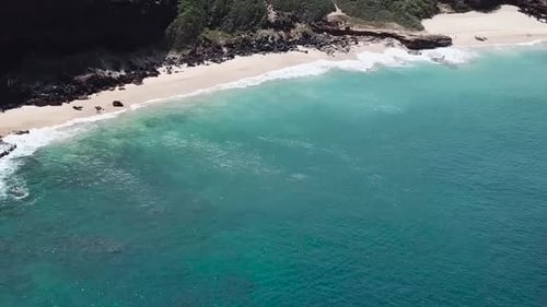 Drone aerial blue water white sand beach Hawaii