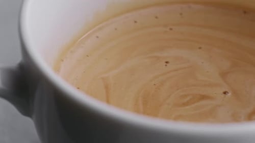 Close Up of Steaming Cup of Coffee
