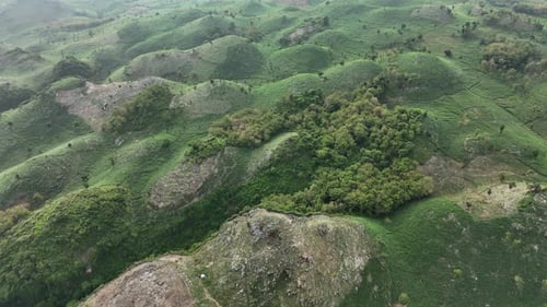 Aerial footage of green hill landscape