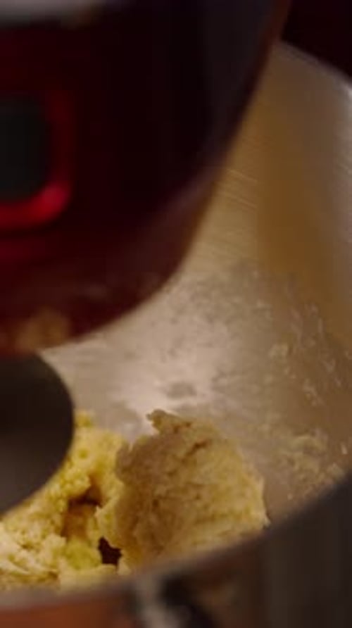 Mixing batter in bowl with kitchen machine