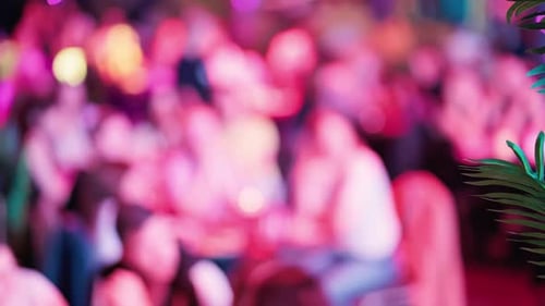 Blurred crowd scene at a night club party