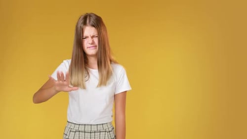 Teenager Gesturing No With Hand On Yellow Background