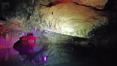 Boating on Underground River in Dark Cave