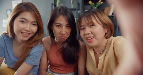 Three Smiling Young Women Posing for Camera