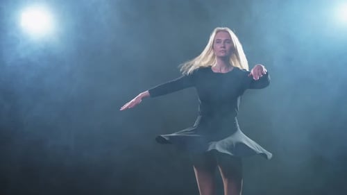 Contemporary Woman Dancer Posing on Black Background with Smoke Adult Female Artist Performer
