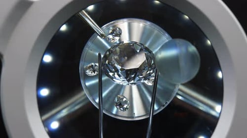 Diamond Being Held by Tweezers Close Up
