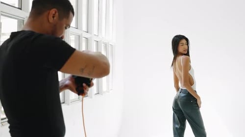 Photographer taking photos of a beautiful woman