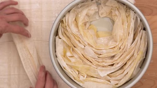 Hands Preparing a Delicious Pie in Kitchen