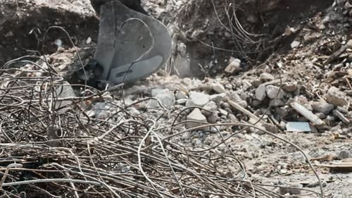 Bulldozer Removes Debris From A Collapsed House 2