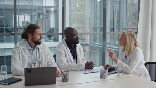 Doctors Having Seminar in Boardroom of Clinic