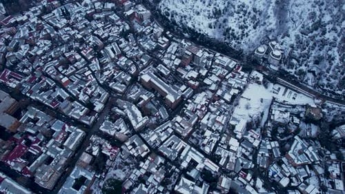 Snow Cowered Roofs In The Winter City