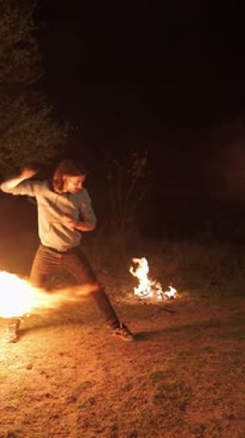 Skilled Fire Dancer Performs at Night