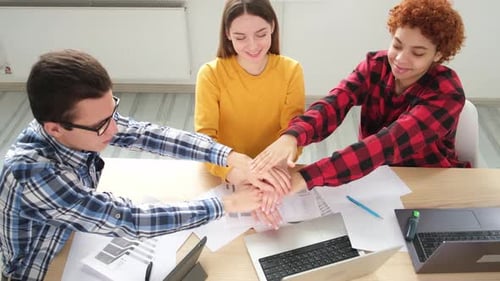 Team Building Stacking Hands in Office