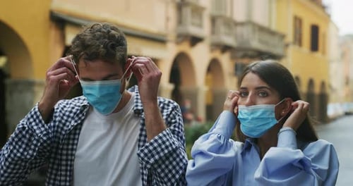 Couple Wearing Surgical Masks in an Urban Setting