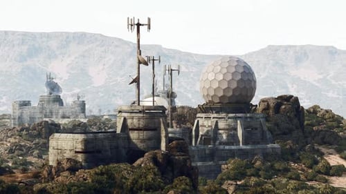 Military Communications Base Nestled in Mountainous Terrain During Daylight