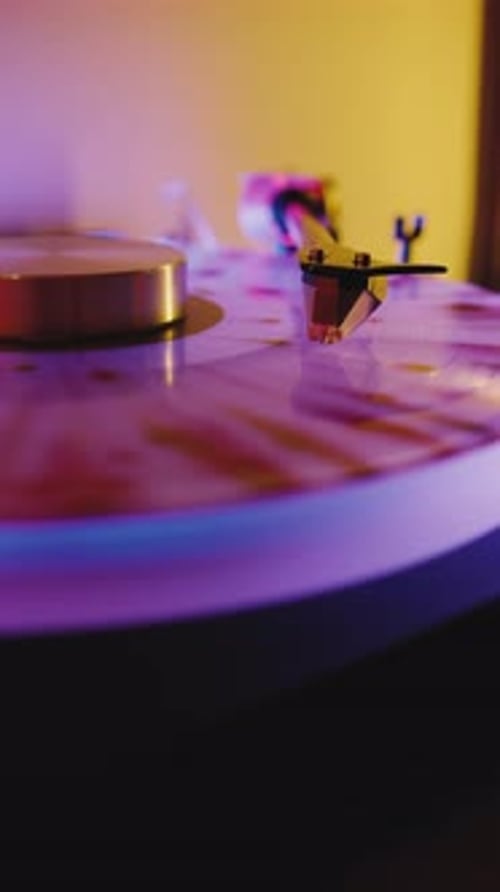 A Charming Vinyl Turntable Showcases a Vibrant Record Spinning Under Soft Ambient Lighting Creating