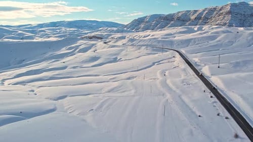 Curving Mountain Road Through Snow