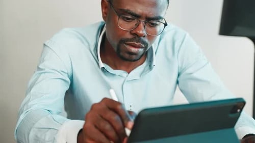 Adult Using Tablet with Stylus in Office