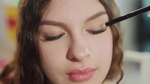 Teenage Girl Receives Makeup Application Close Up