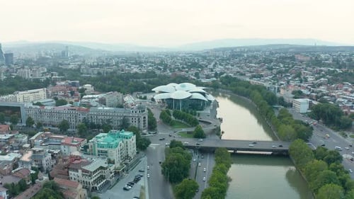 Aerial view of downtown Tbilisi, Georgia with mountains in the background. Modern architectural land