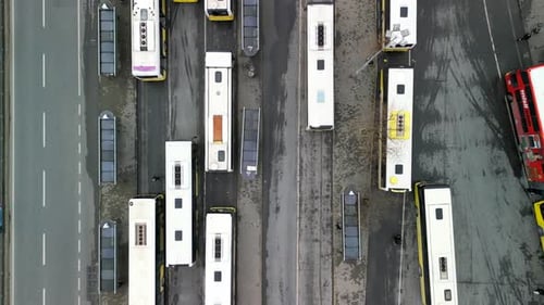 Many Buses at a bus station, drone top-down shot