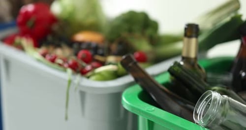 Recycling Bins Full of Food Waste and Glass