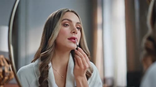 Smiling Model Holding Brush Painting Lips at Bedroom Closeup Beauty Routine