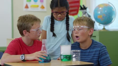 Enthusiastic Children Conduct Science Experiment in Classroom