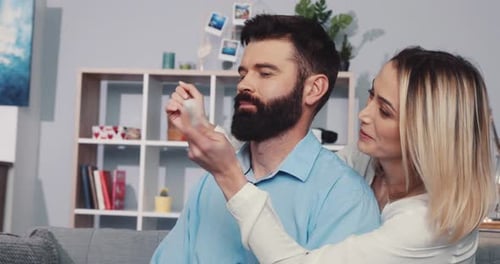 Happy Couple Embrace Good News in Cozy Home