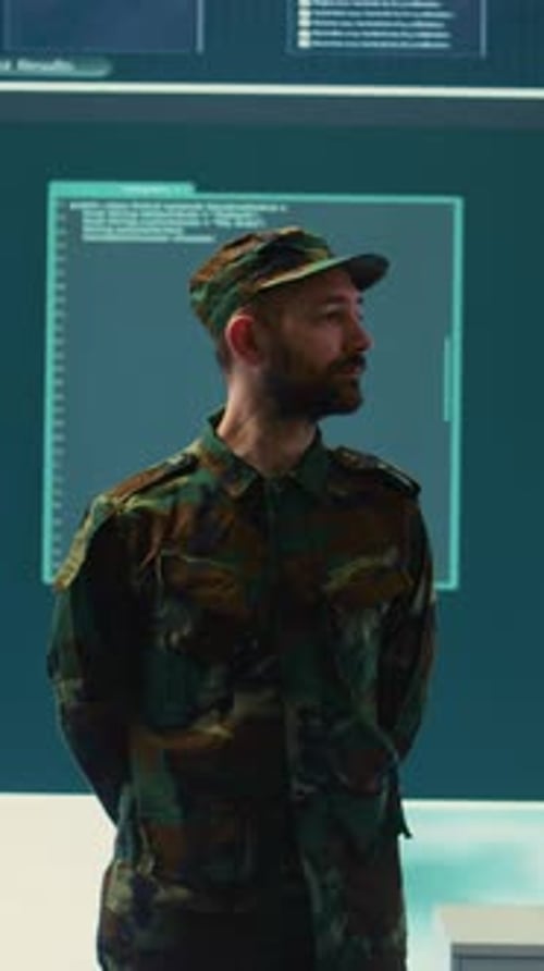 Soldier in Military Uniform Standing in Computer Room