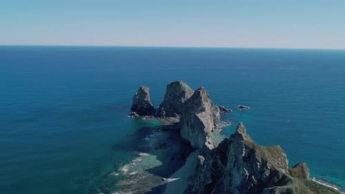 Aerial Panoramic View of Cliffs and Huge Rocks at Seaside and Waves Crashing to the Coast Beautiful