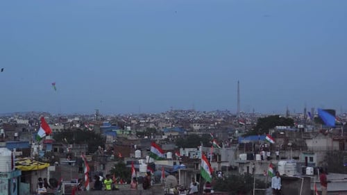 Crowds celebrate on rooftops in Indian city