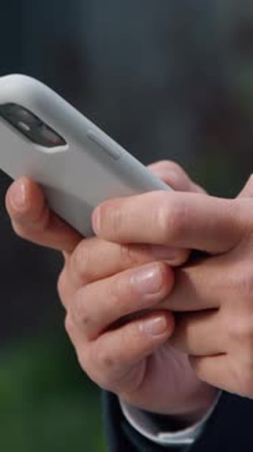 Close Up Male Hands Typing Texting Message Browsing Mobile Phone in City Unrecognizable Business Man