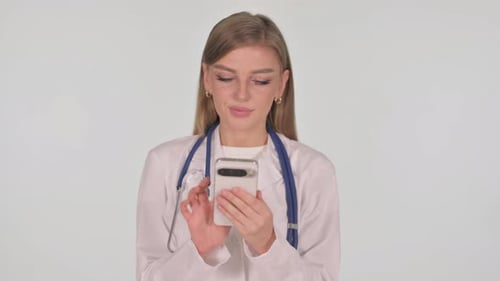 Young Doctor Using Cell Phone in Medical Setting