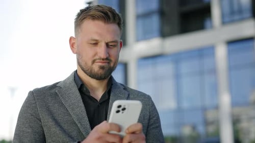 Young Adult Using Smartphone in the City