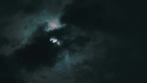 Night Moon Through Moving Dark Clouds