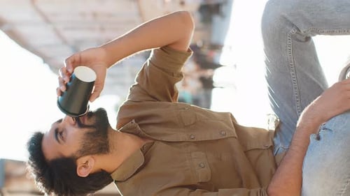 Adult Indian Man Enjoying Drinking Morning Coffee Hot Drink Relaxing Taking a Break in City Street