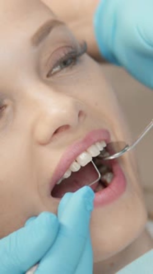 Woman Receiving Dental Exam Close Up