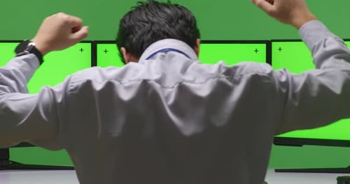 Back View Happy Asian Man Celebrating And Dancing While Working With Mock Up Multiple Monitor